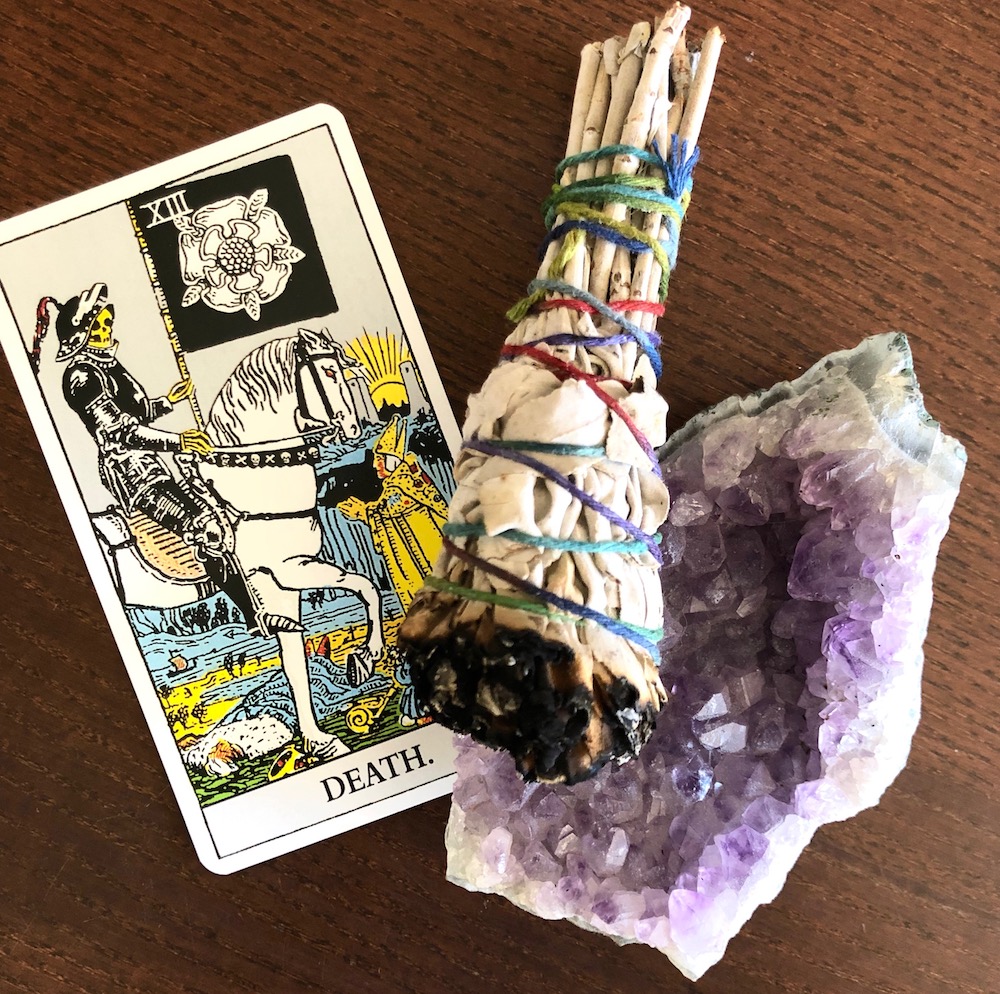 The Death Card in the Rider Waite tarot deck with a sage bundle and amethyst