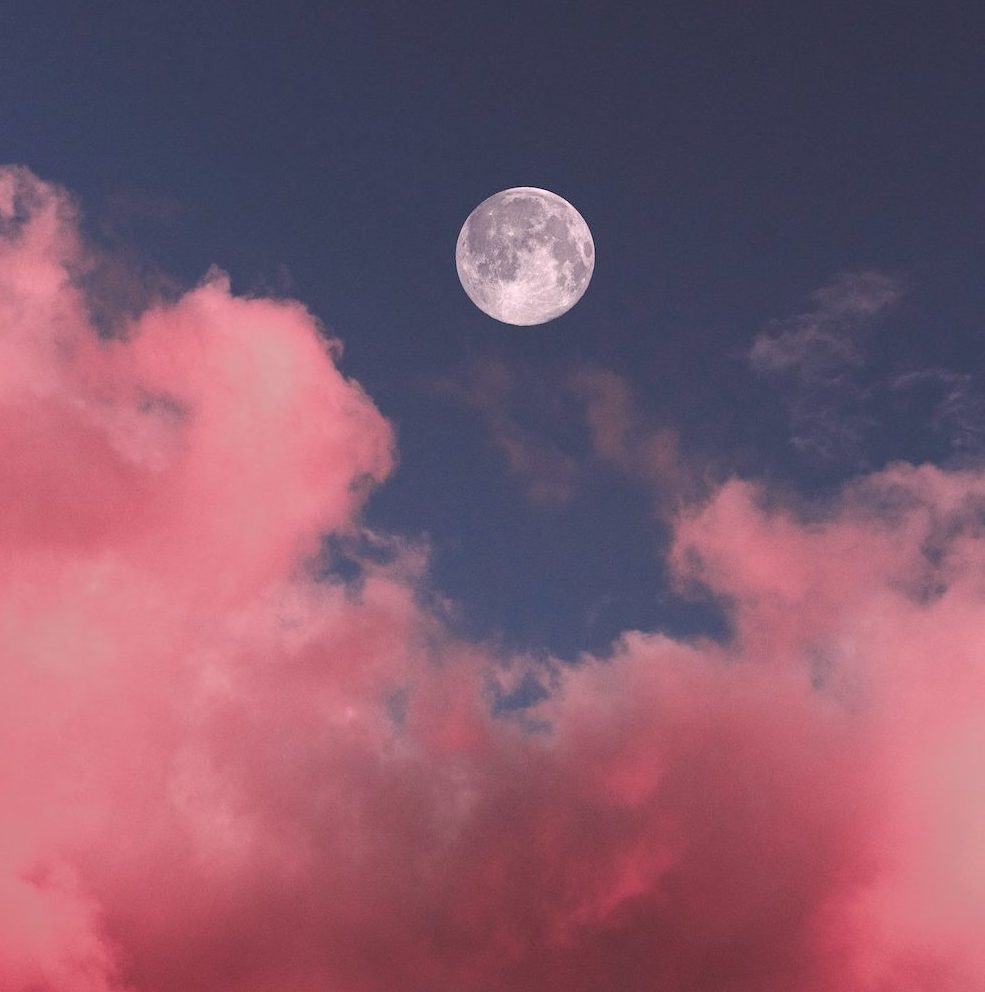 How to Interpret Your Dreams in 3 Steps | Happy As Annie | Best Life Book Club May selection is Steering by Starlight by Martha Beck, in which she explains how our intuition communicates with us through dreams. (Pink puffy clouds and blue sky with bright full moon in center)