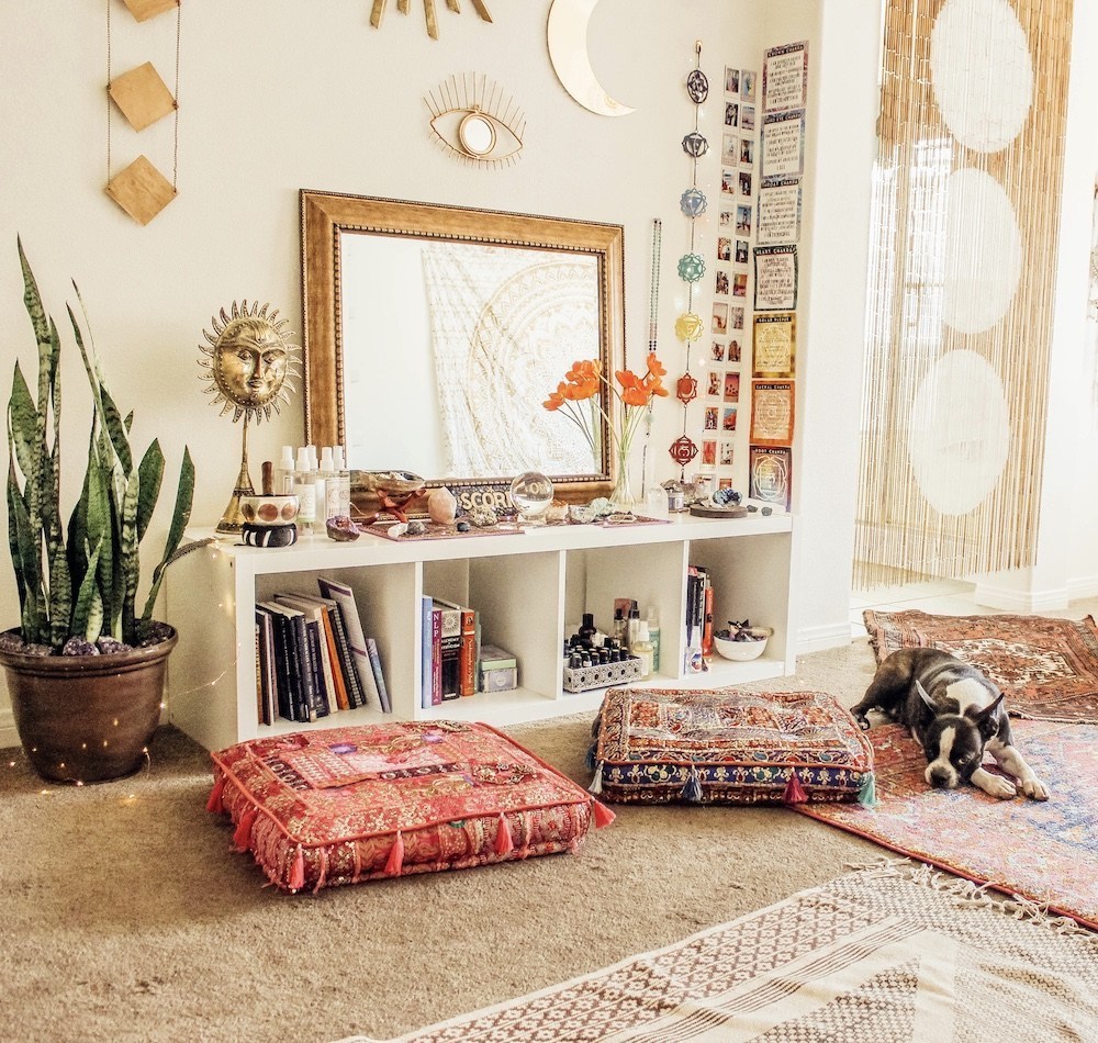 Happy As Annie | 7 Meditation Room from Pinterest You Ned to Copy - and how to get the look! (Dog laying on rugs next to cushion pillows in meditation space with spiritual decor and items)