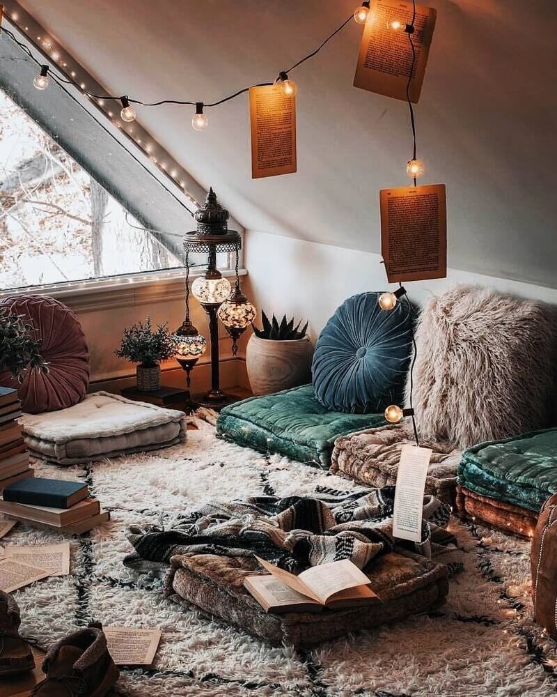 Happy As Annie | 7 Meditation Room from Pinterest You Ned to Copy - and how to get the look! (Meditation room with subdued jewel tone cushions and textiles and string lights)