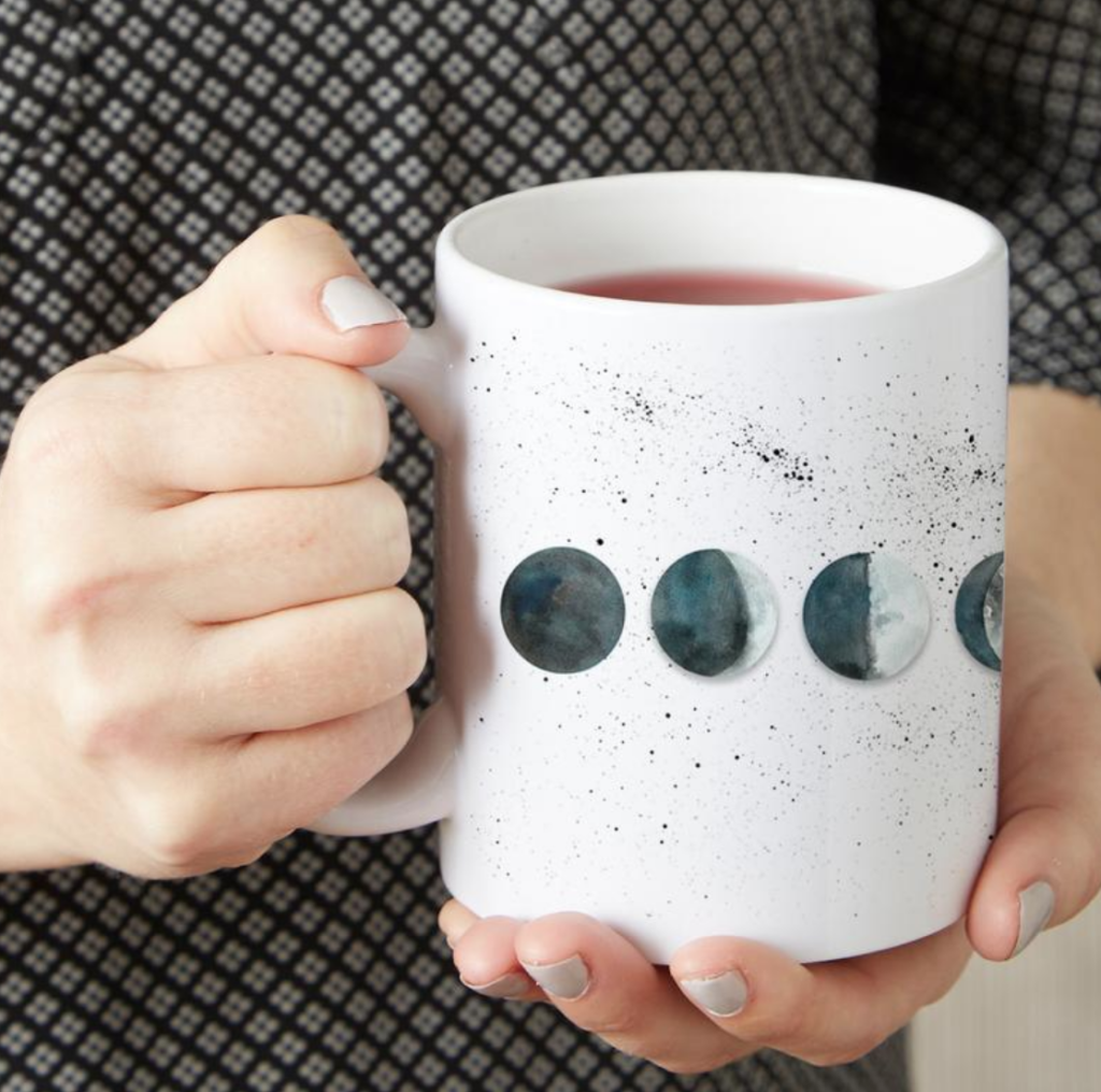 Watercolor moon phases coffee mug by Mirkwood  Scribes on Etsy on The Ultimate Witchy Gift Guide by Happy As Annie