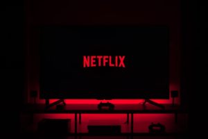 Red Netflix logo on black TV screen